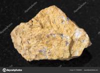 rough-narsarsukite-stone-on-dark